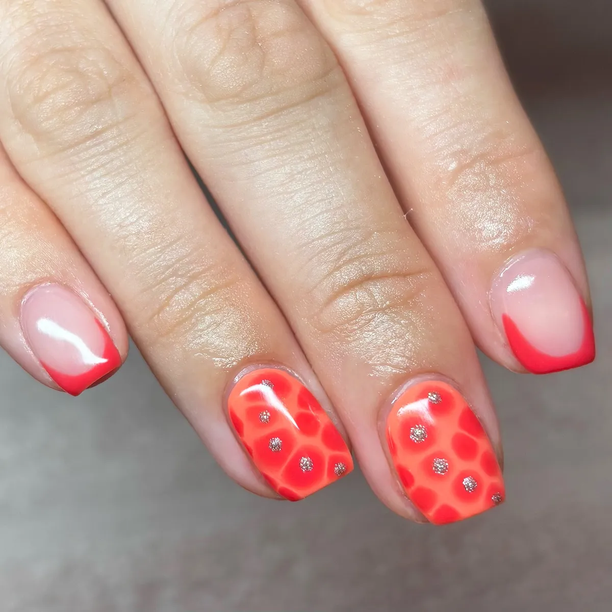 Neon coral spots with red French tips