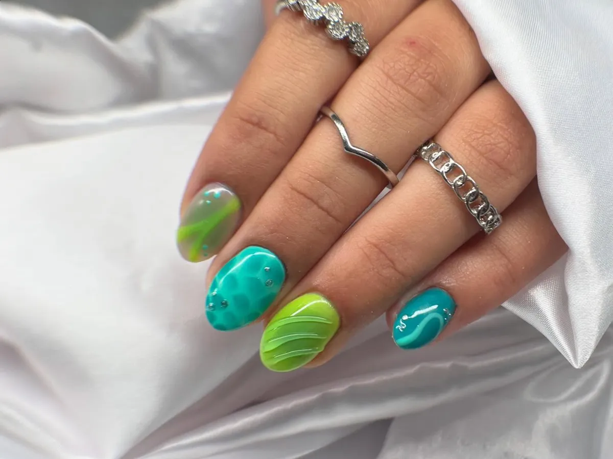 Teal and lime textured nails with small dots
