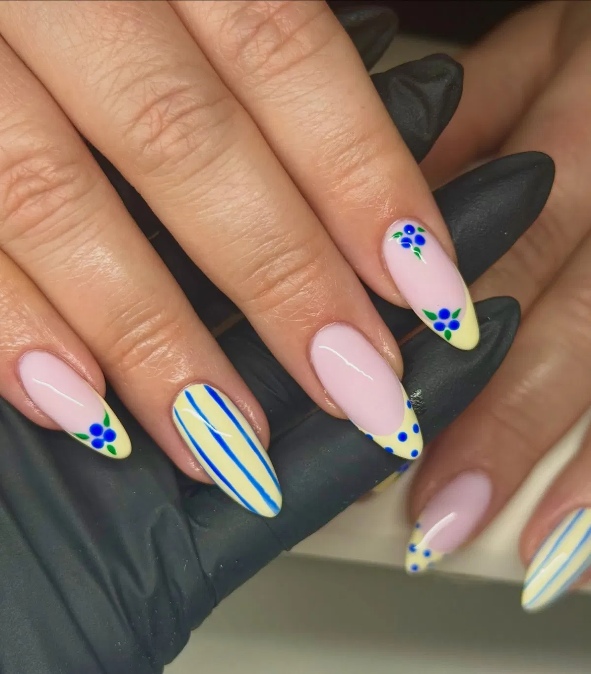 Pale pink and yellow tips with blue floral details