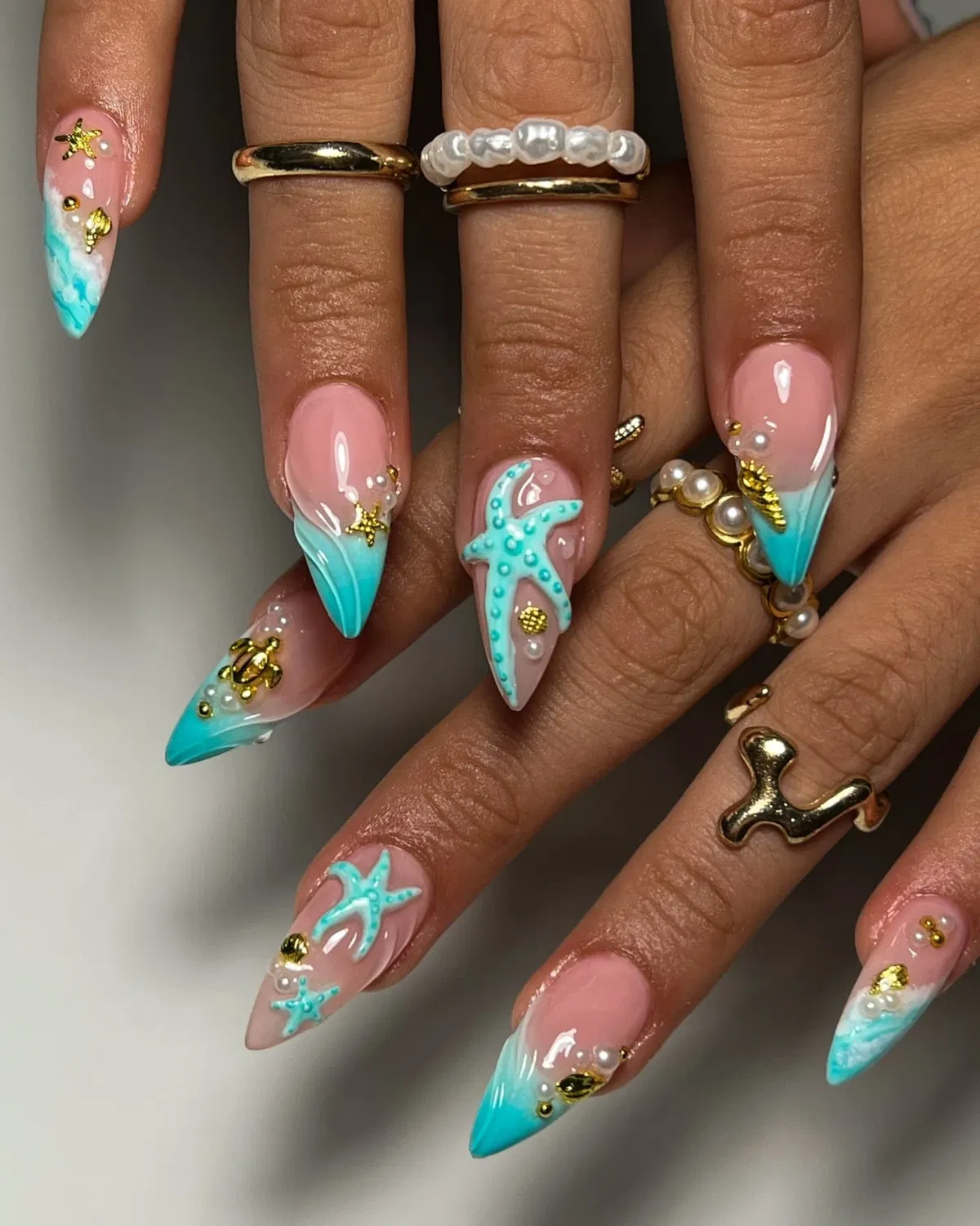 Turquoise ombré tips with 3D starfish and gold accents